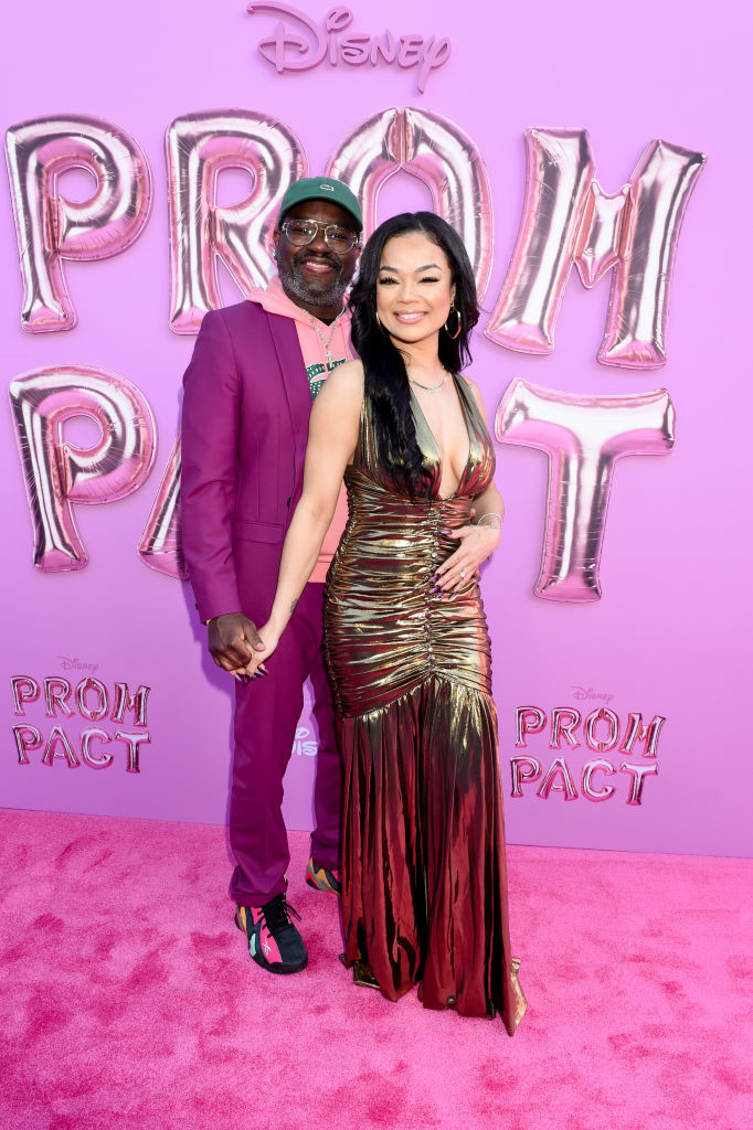 Closeup of Lil Rel with his arm around Dannella at an event