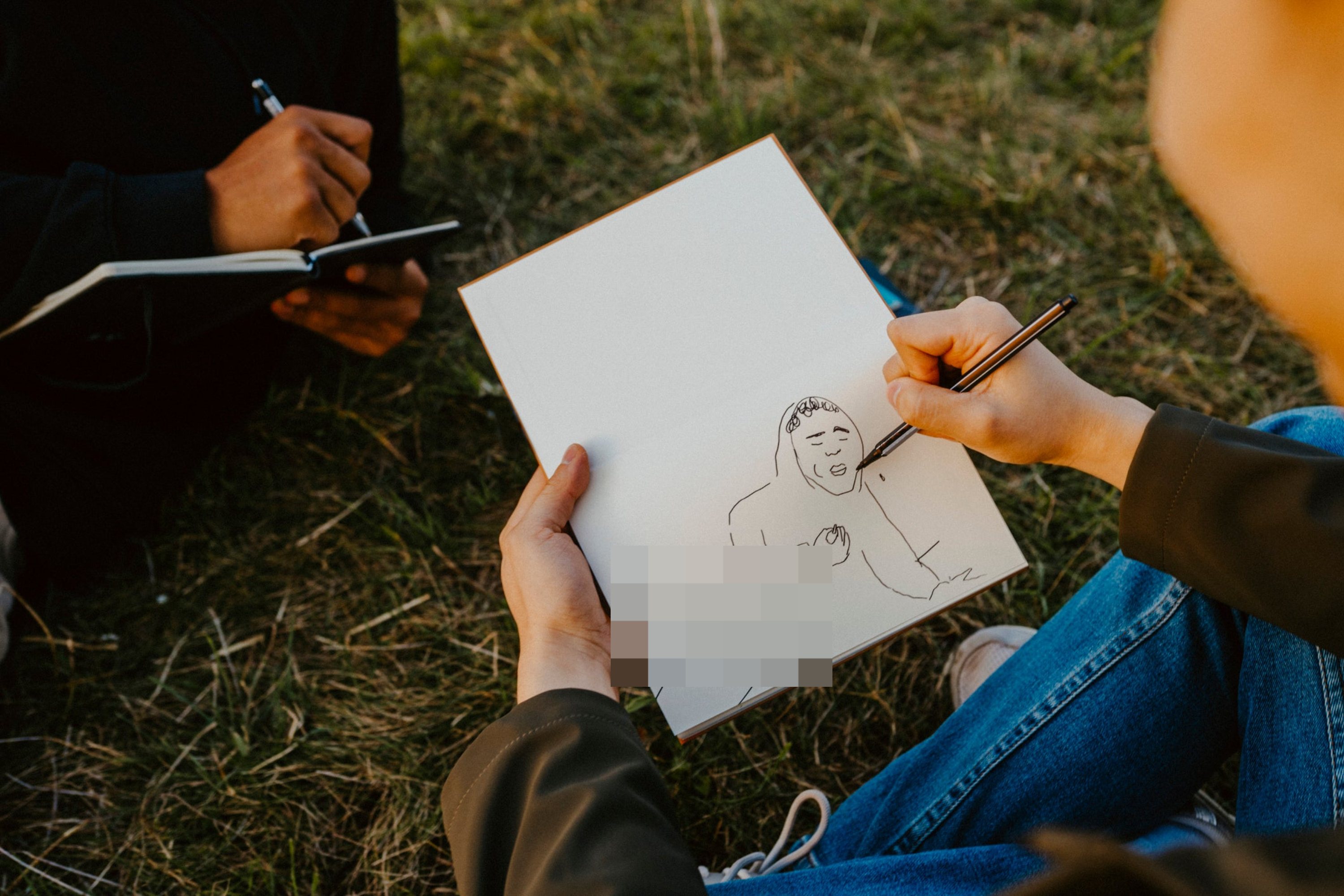 Person sketching a man