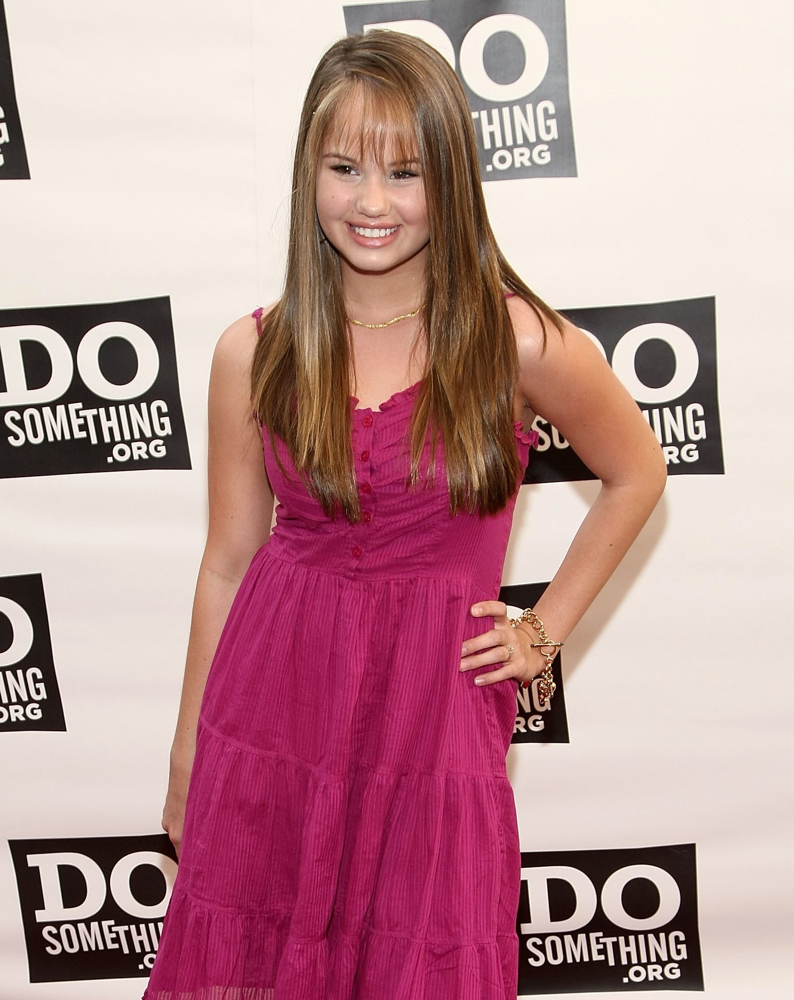 wearing a dress with hair long and bangs