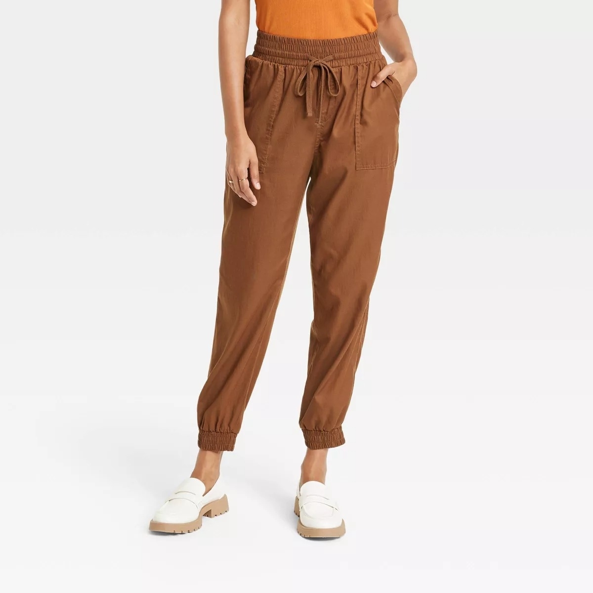 brown joggers with drawstring waist on model