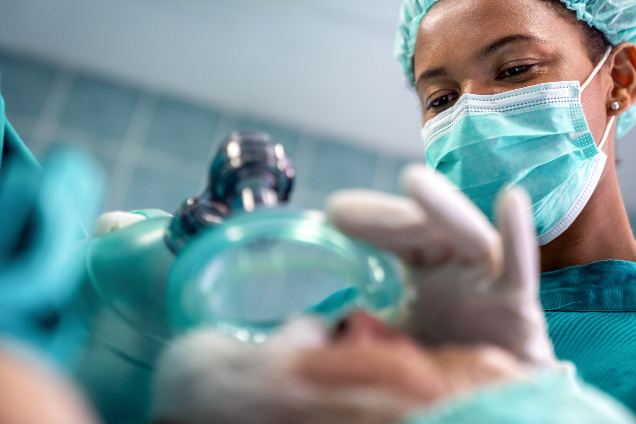 A doctor working on a patient in surgery