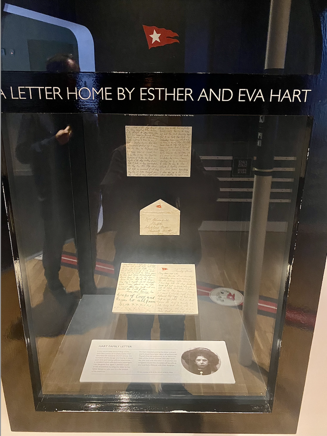 the letter on display with a photo of esther hart