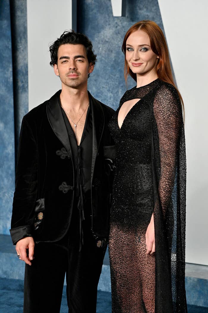 The former couple posing for photographers on the red carpet at a media event