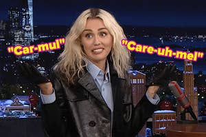 Miley Cyrus shrugs.