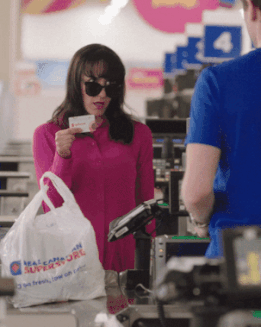 GIF of a woman coming back for her groceries