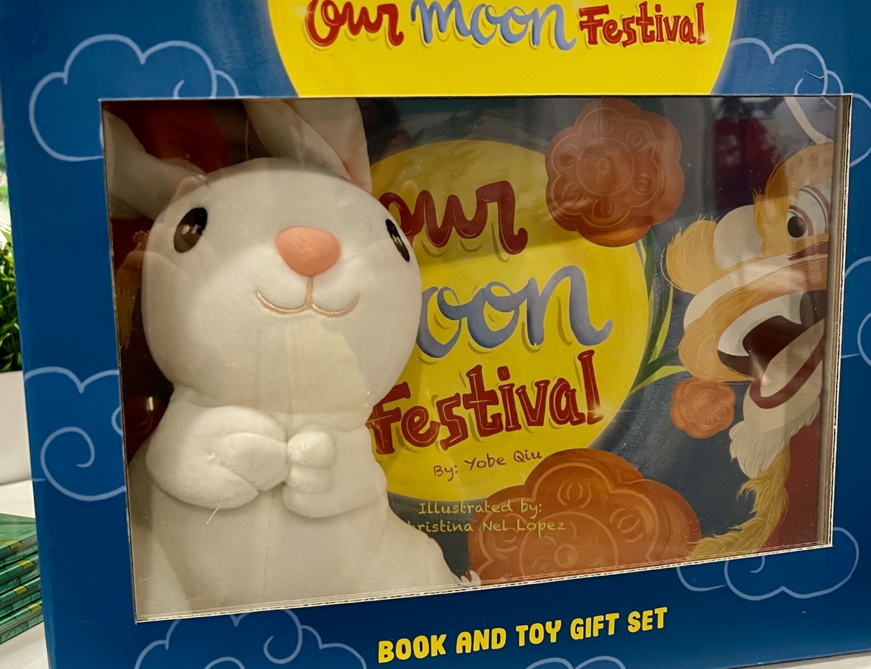 Blue box with toy bunny and &quot;Our Moon Festival&quot; book.