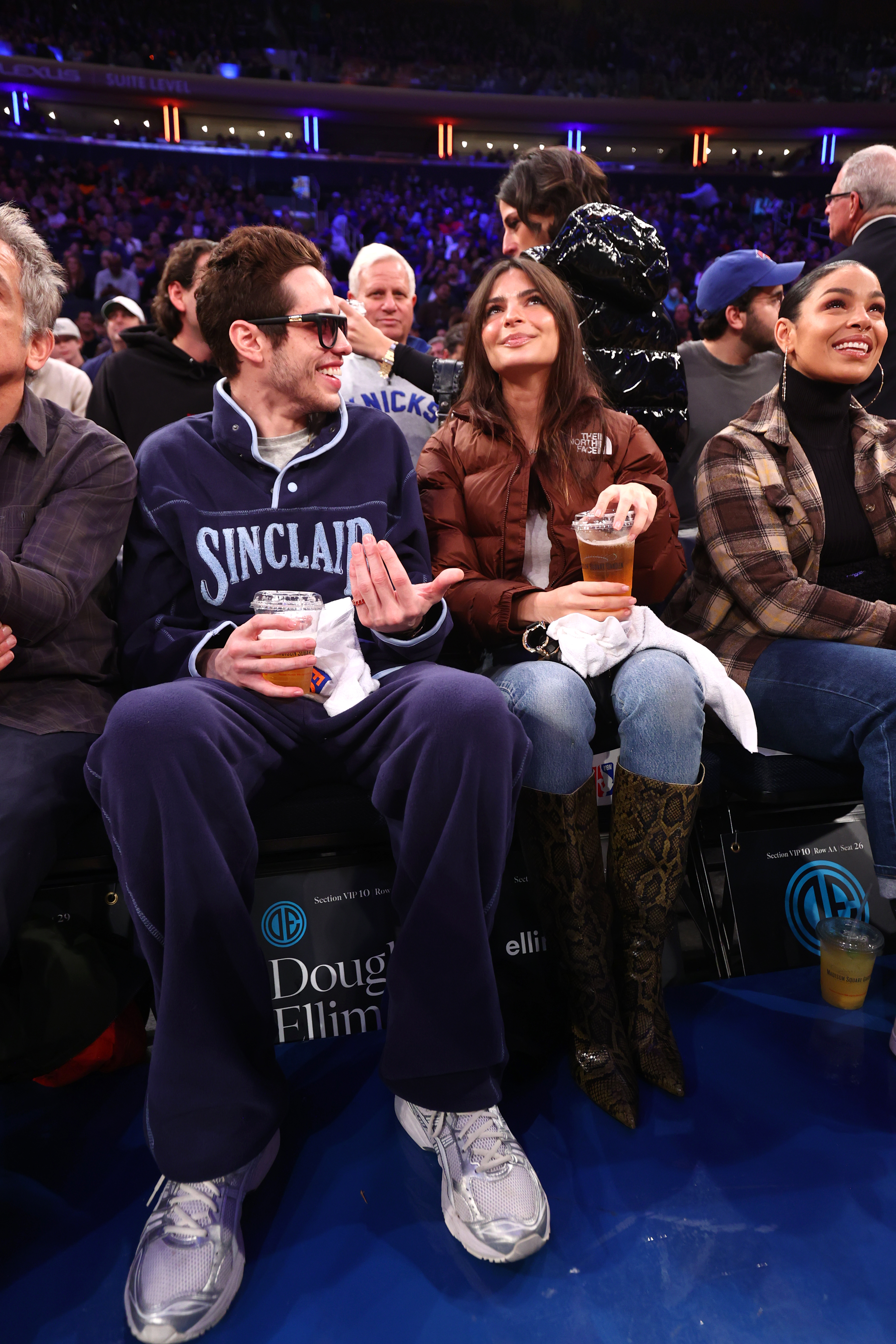 Pete and Emily sitting in the audience at a sports event