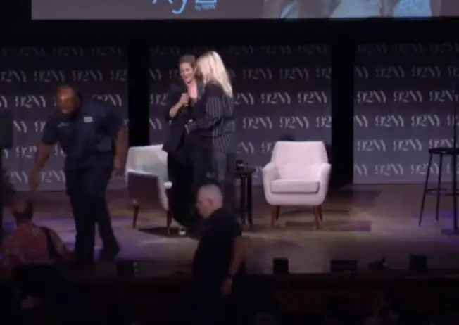 Close-up of Drew and Reneé at the 92nd Street Y walking offstage