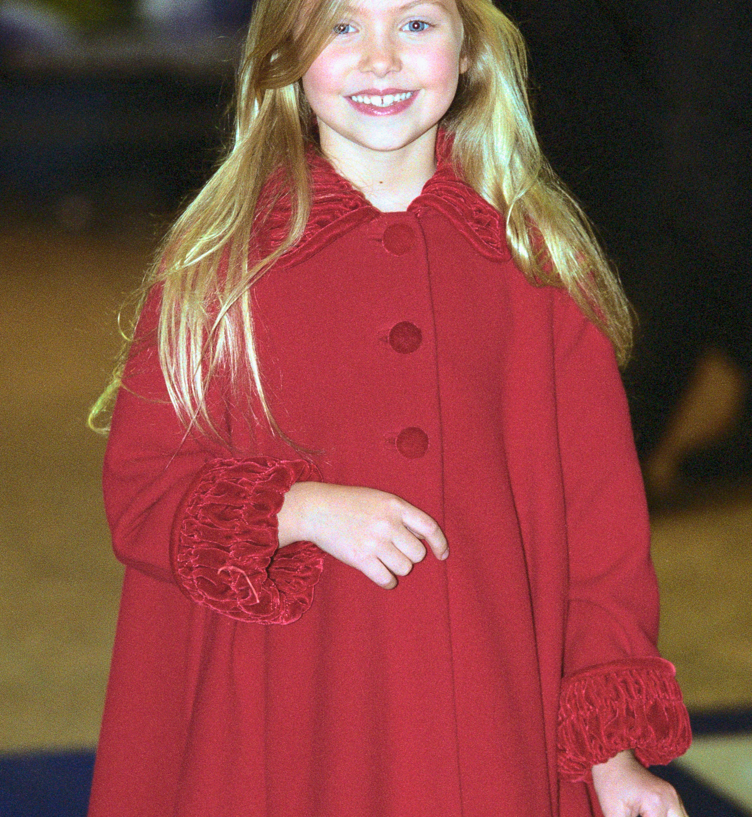 Close-up of Taylor as a child smiling at an event