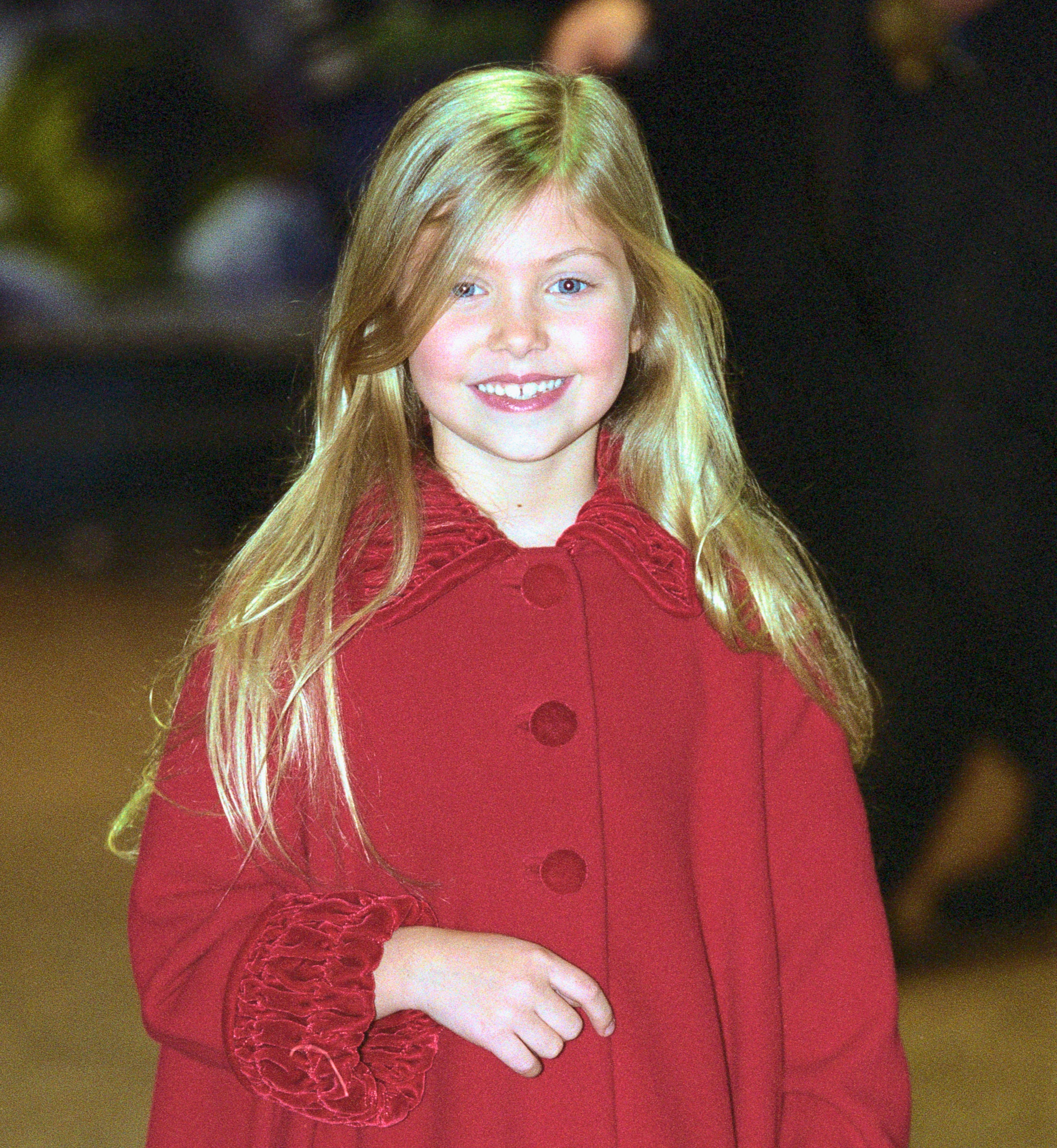 Close-up of Taylor as a child smiling at an event