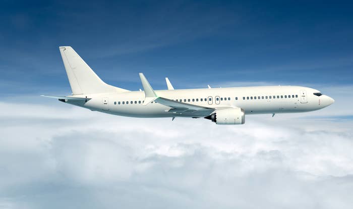 A plane flying above the clouds