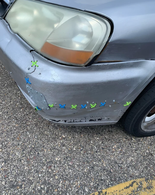 zip ties used to hold up a car bumper