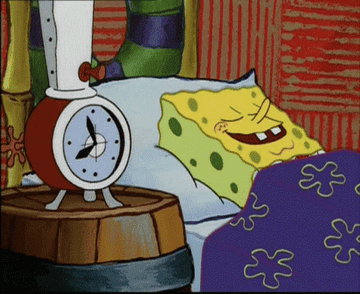 A gif of SpongeBob SquarePants sleeping next to an alarm clock