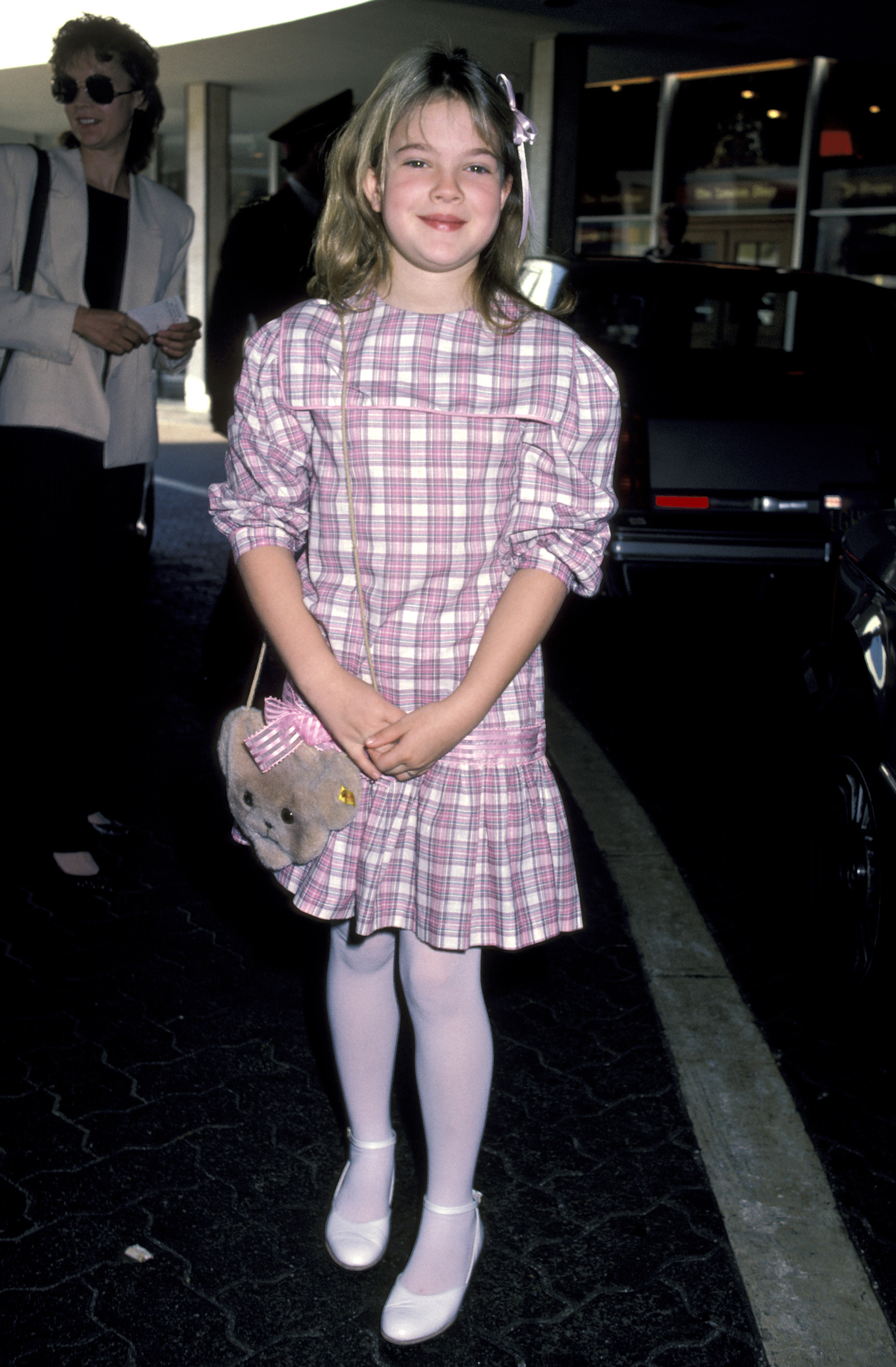 Drew Barrymore on a red carpet as a young girl