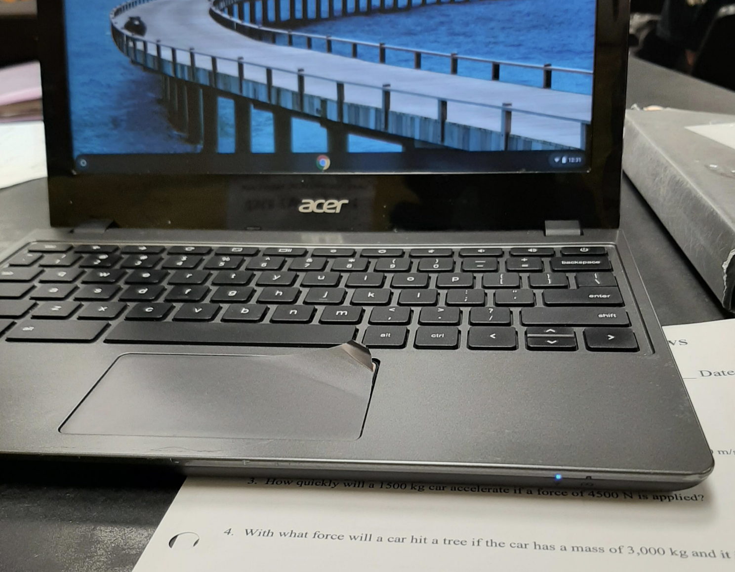 A peeling track pod on a laptop