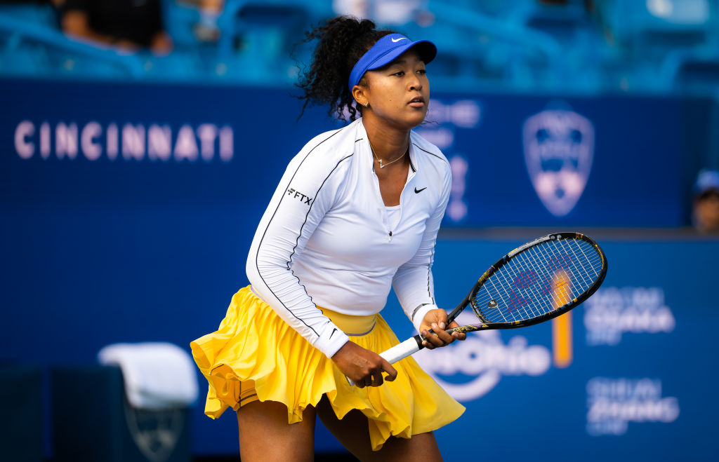 Naomi Osaka playing a tennis match