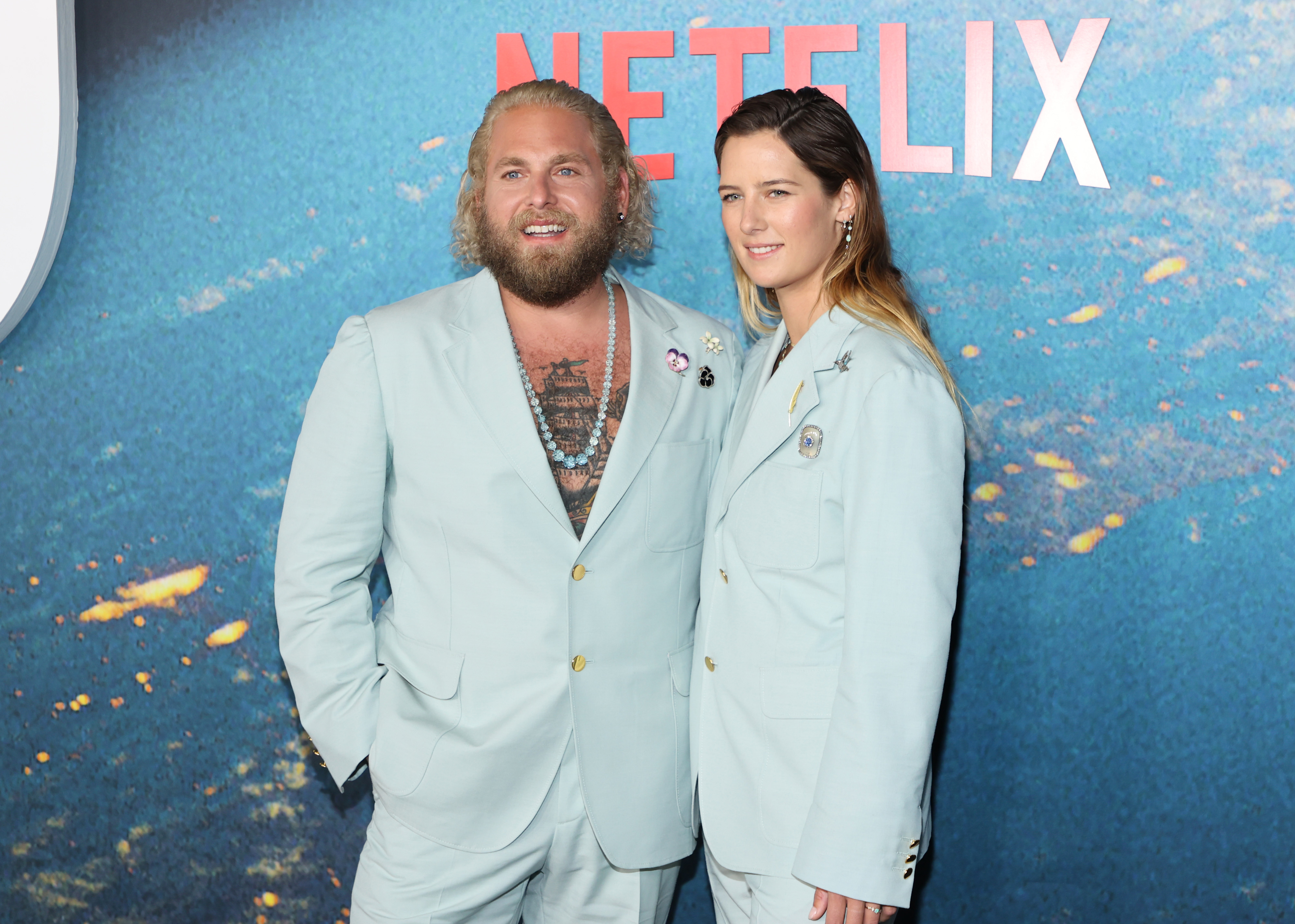 Jonah and Sarah at a media event in matching suits