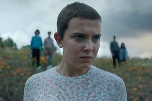 Eleven from Stranger Things staring out fiercely