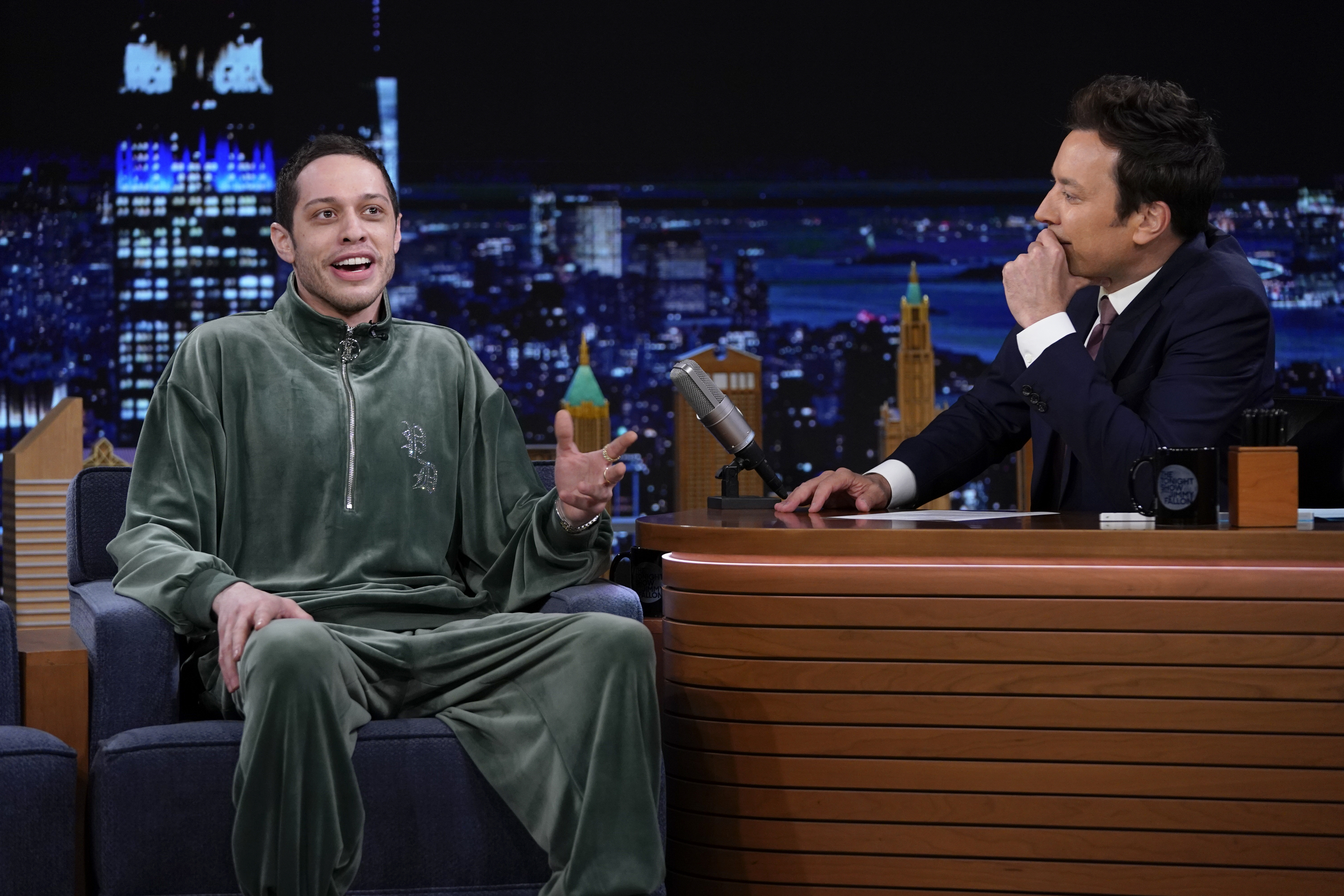 Pete Davidson speaks as Jimmy Fallon listens during an interview