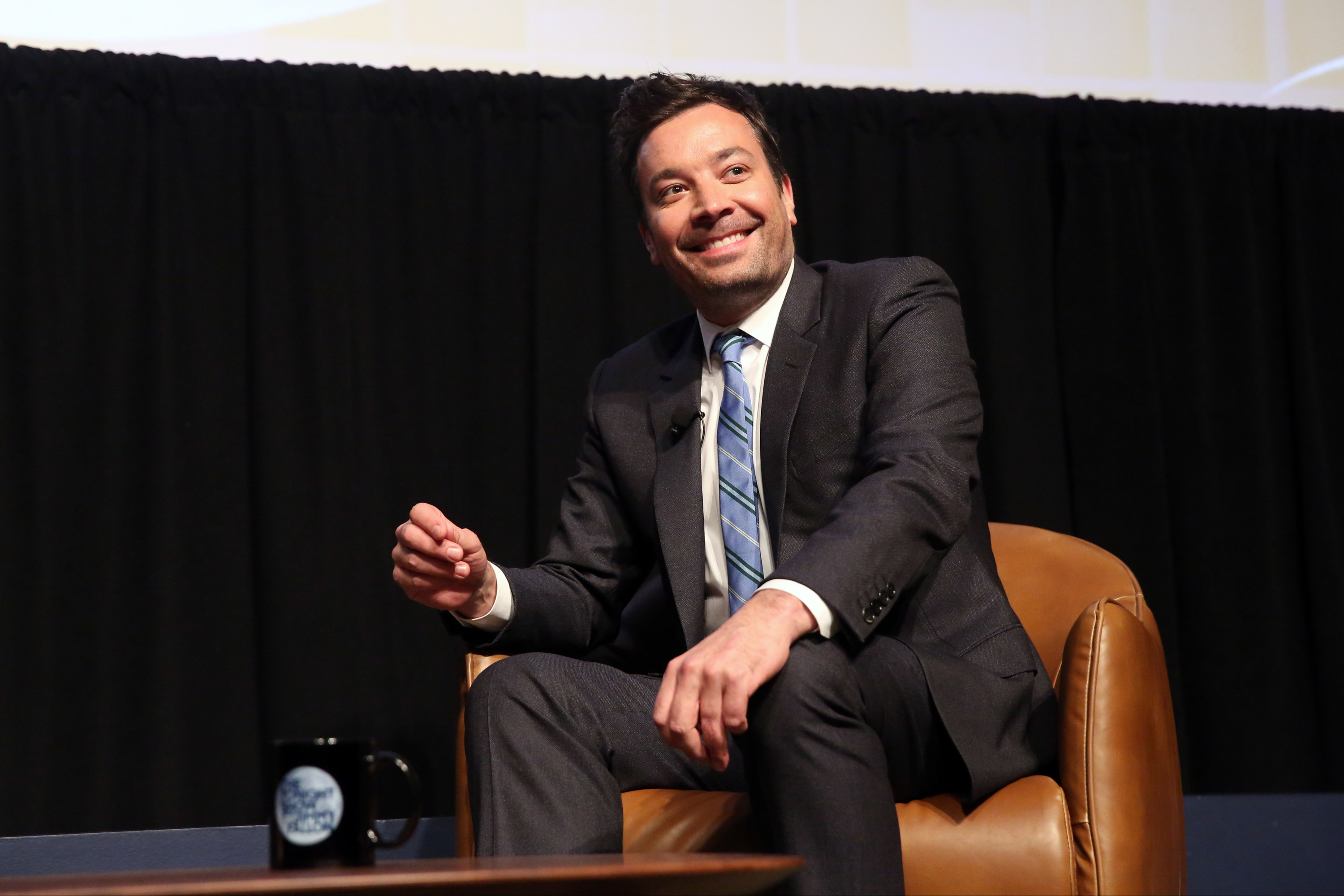 A close-up of Jimmy Fallon sitting and smiling