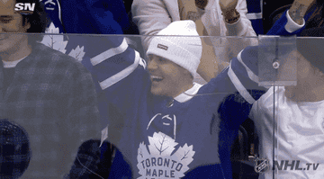 Justin Bieber cheering in Toronto Maple Leafs attire