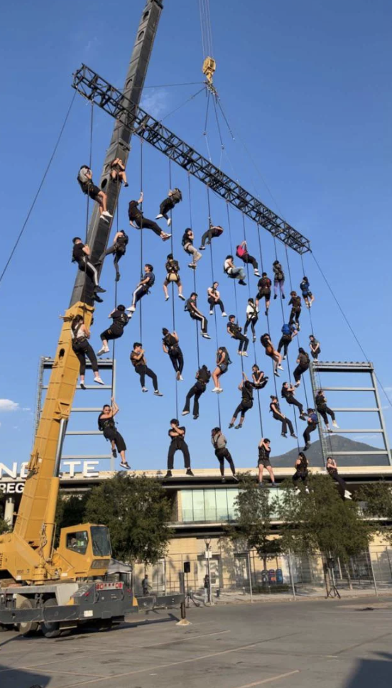 People hanging on ropes