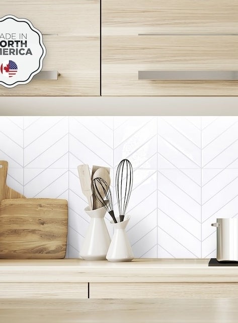 the white chevron tiles in a kitchen as a backsplash