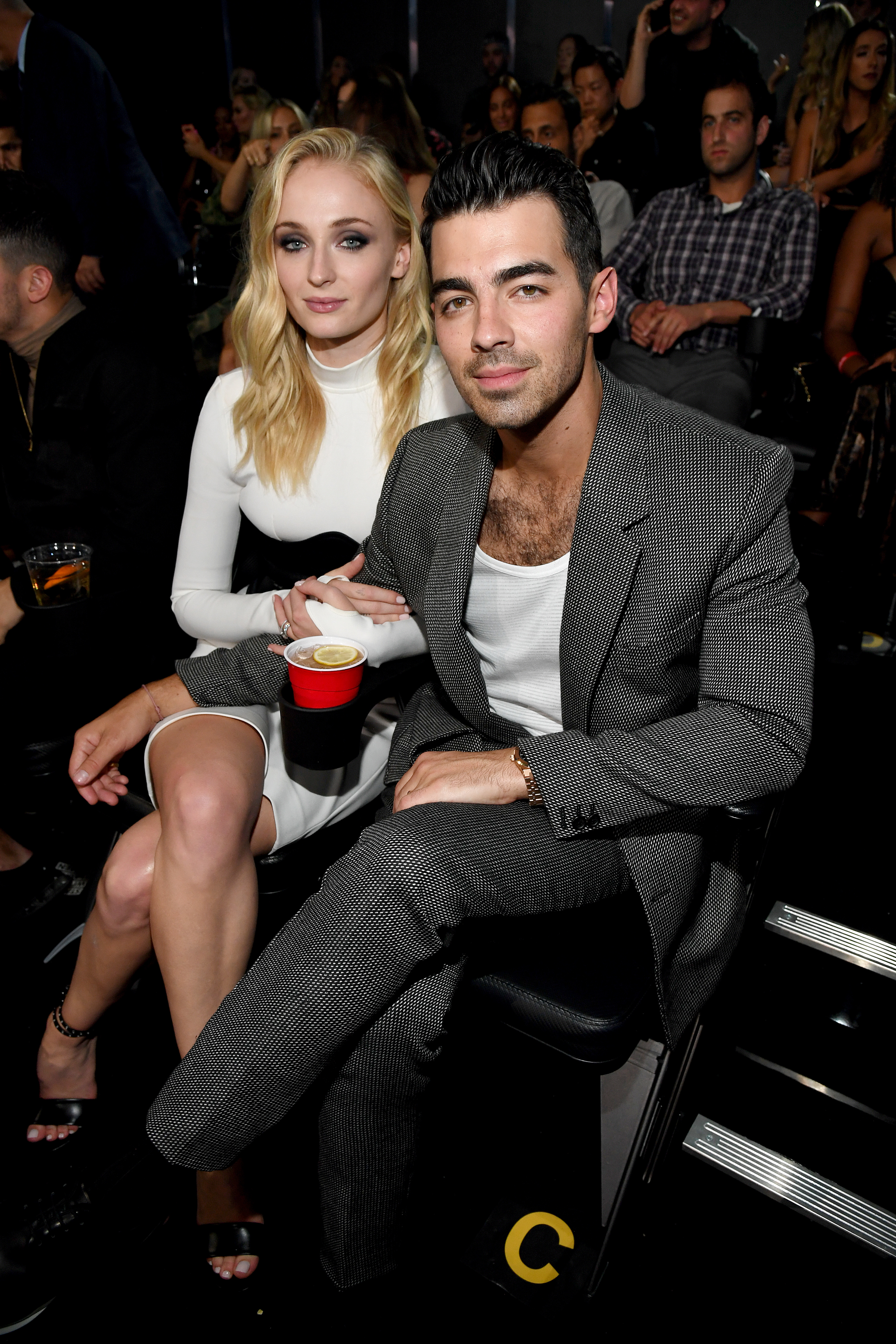 closeup of Sophie and Jo sitting in the audience at an event