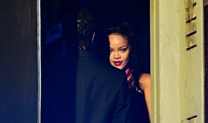 closeup of rihanna looking over Asap&#x27;s shoulder as he stands with his back to the camera