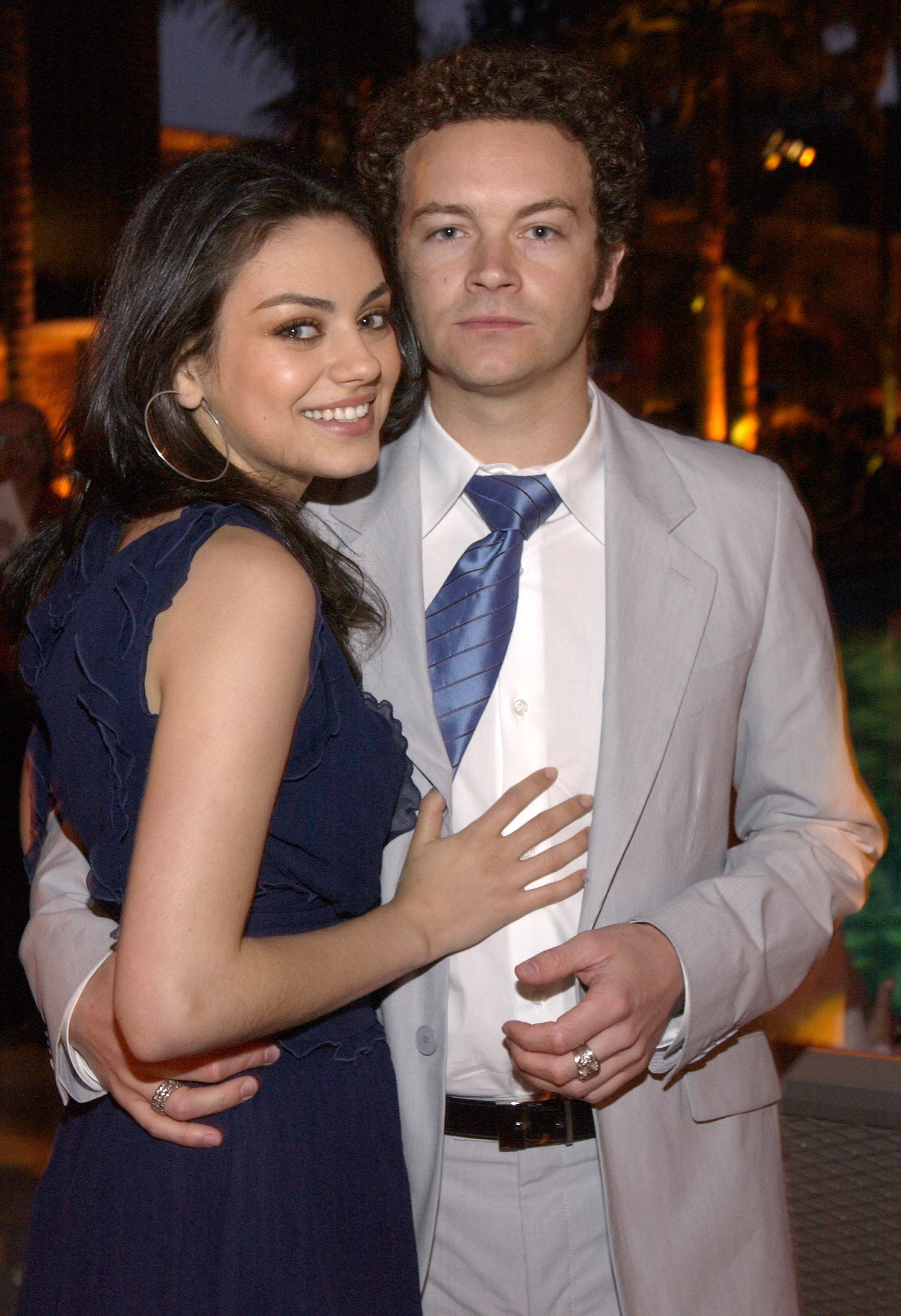 mila and danny posing together for a photo at an event