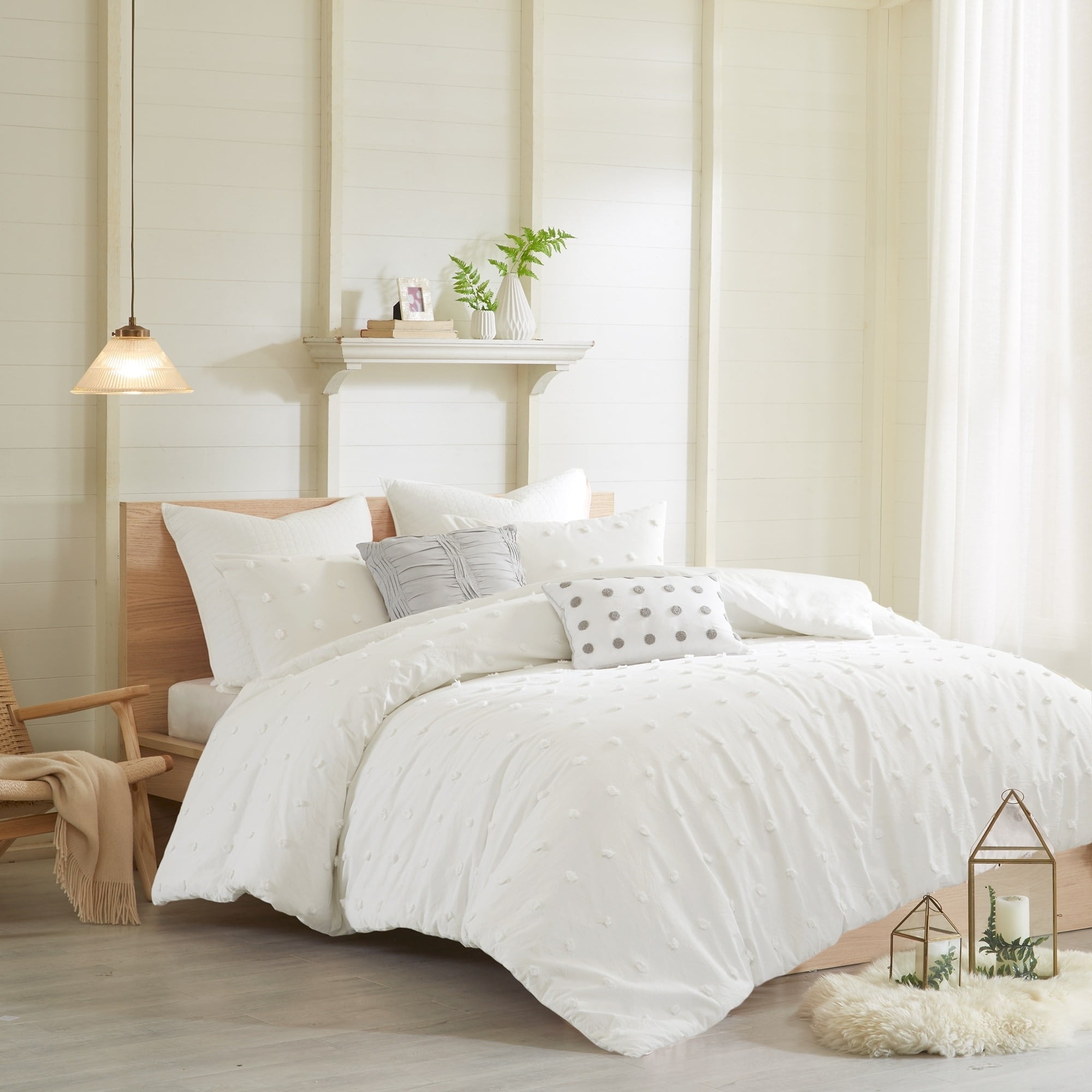 white fluffy bedding set on a bed