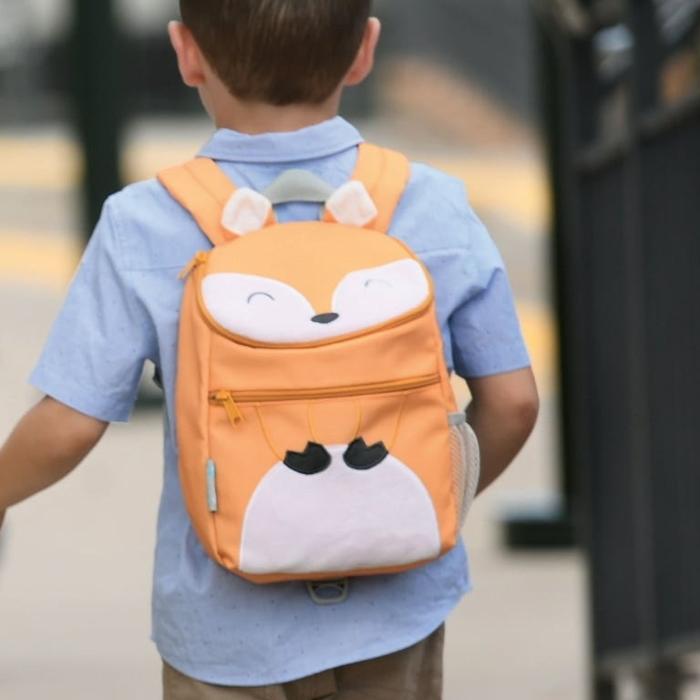 A young child wears a backpack