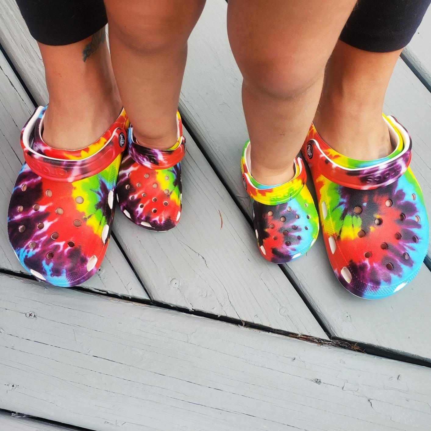 tie dye crocs on adult and kids size feet