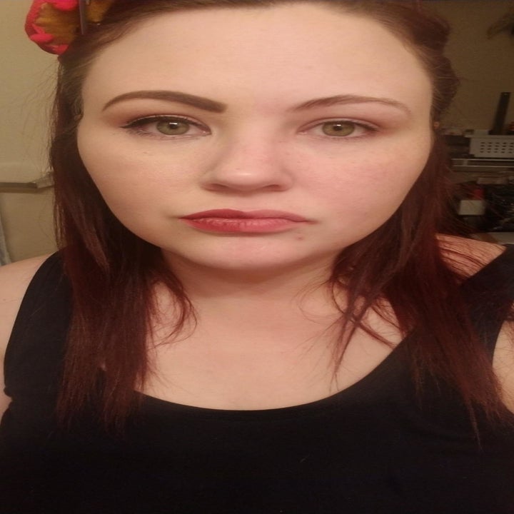 a reviewer with half of their face free from makeup