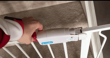 reviewer's gif showing how to open the door latch easily with one hand