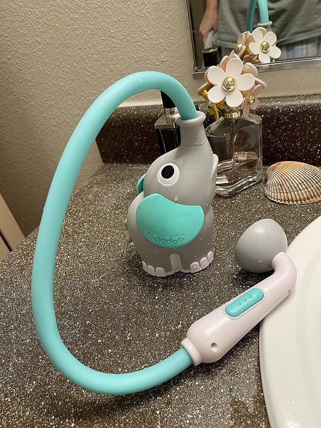 an elephant hose spraying toy for a child's bath