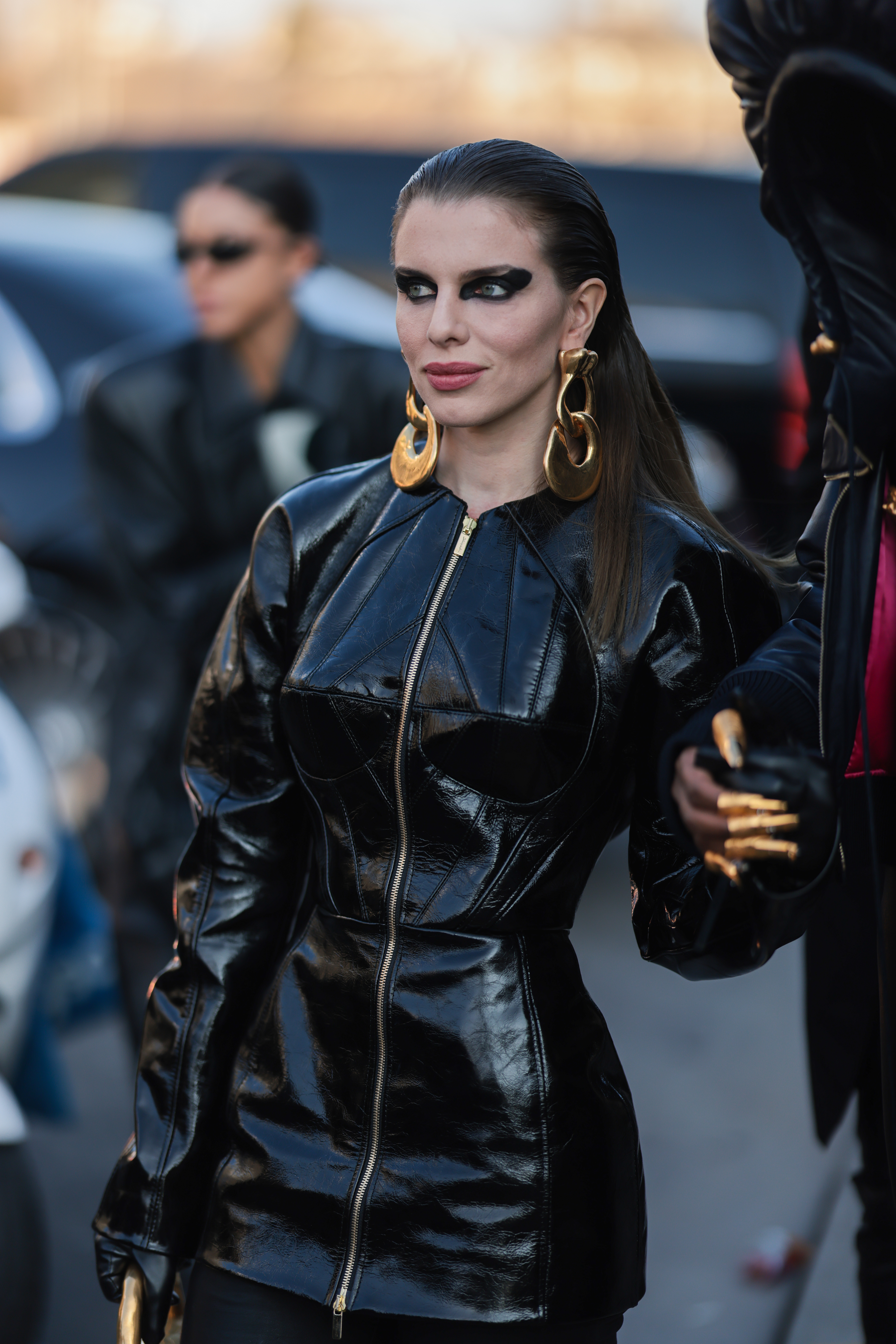 closeup of julia wearing a patent leather outfit