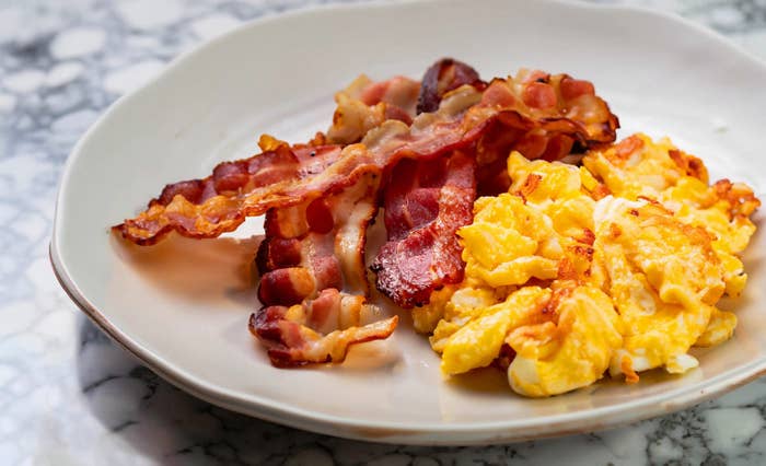 a plate with eggs and bacon