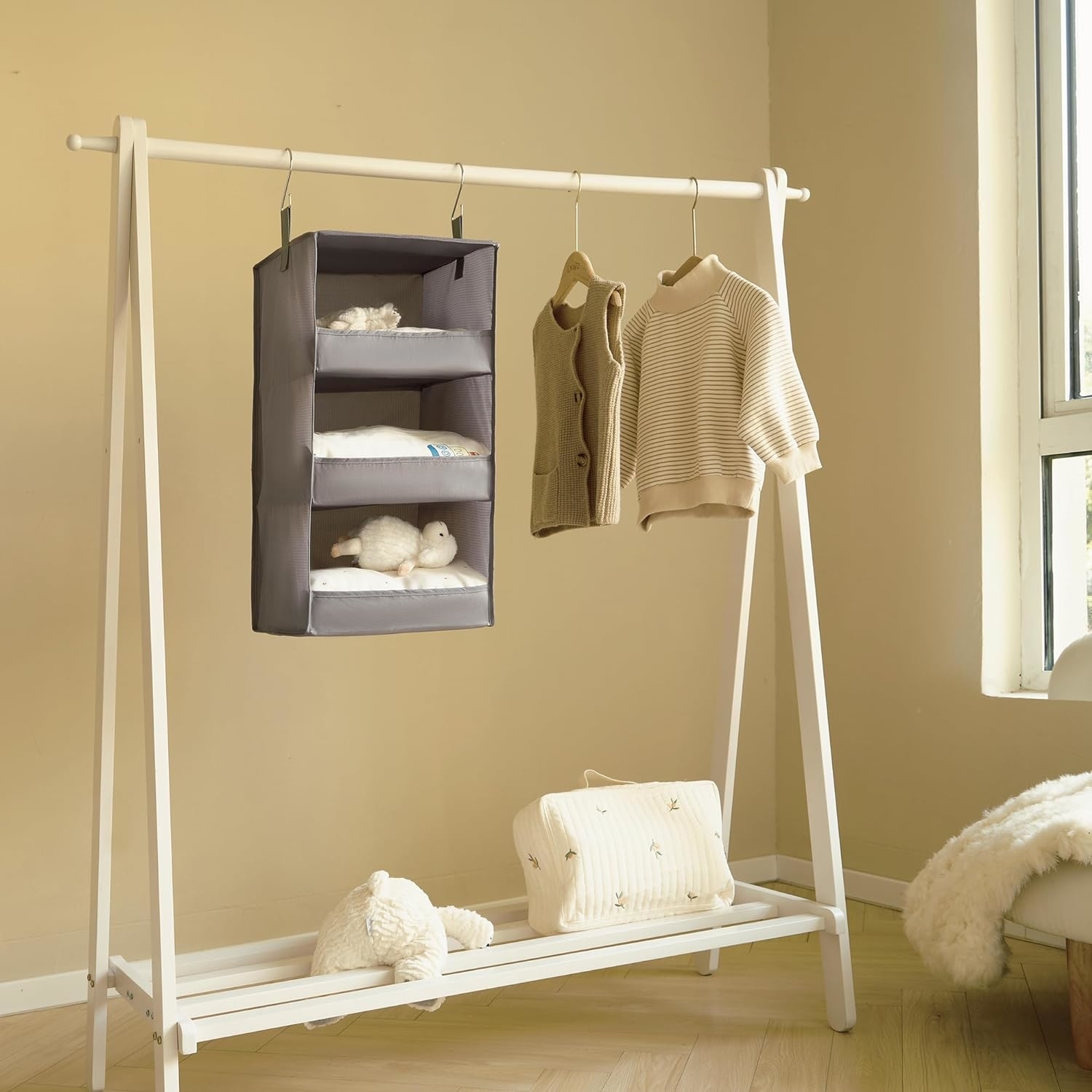 gray hanging organizer on a rack in a nursery