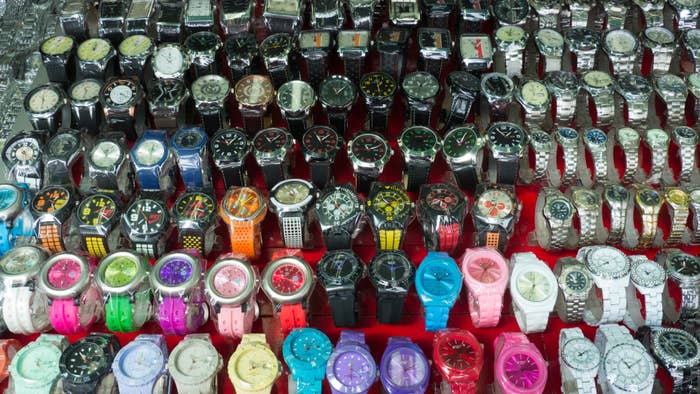 a bunch of fake watches are pictured