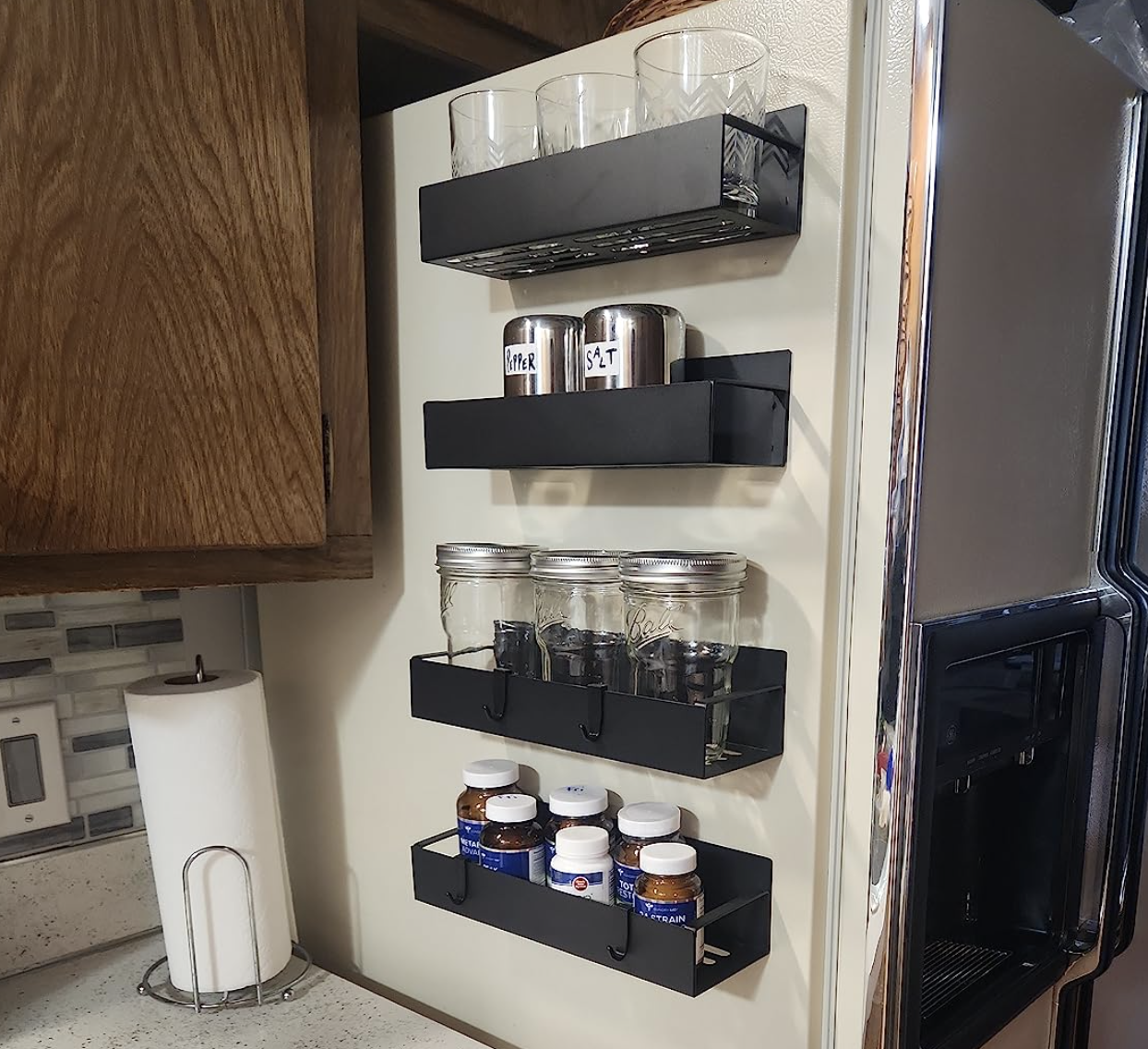 reviewer photo of the magnet shelves on the side of a fridge