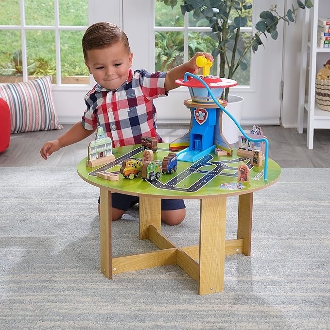 A child playing with the activity table