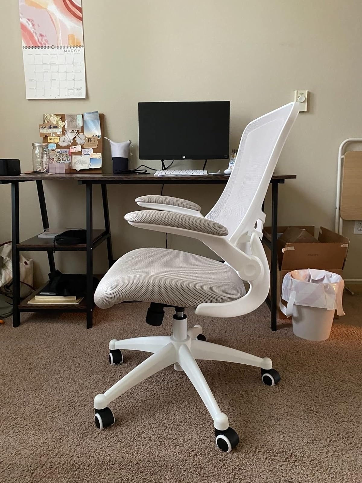 white mesh ergonomic desk chair with lumbar support near desk