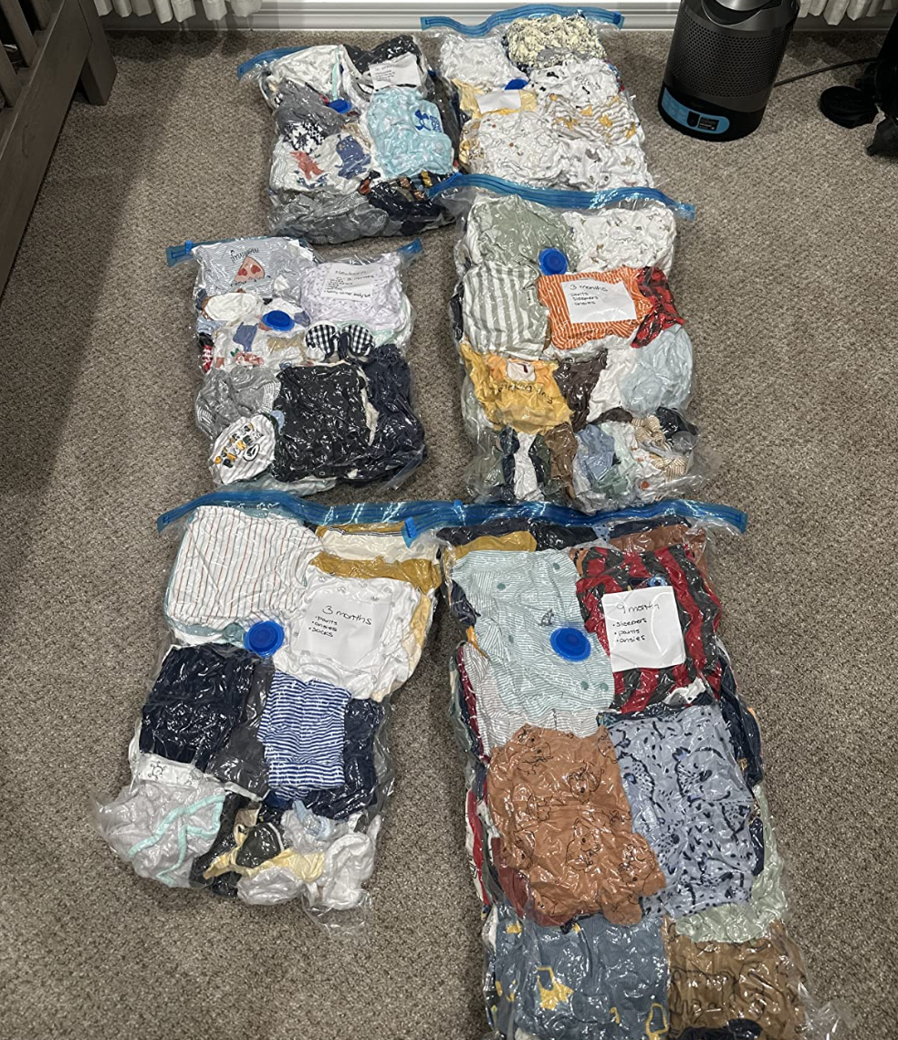 reviewer photo of the vacuum storage bags holding various clothing items