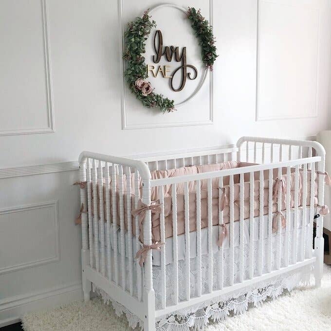 a reviewer photo of the white crib