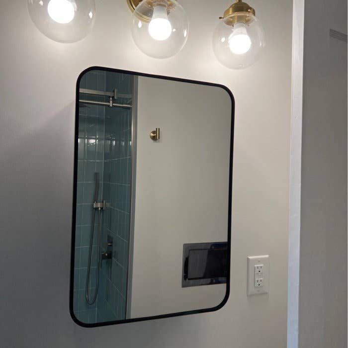 reviewer image of the black trimmed mirror