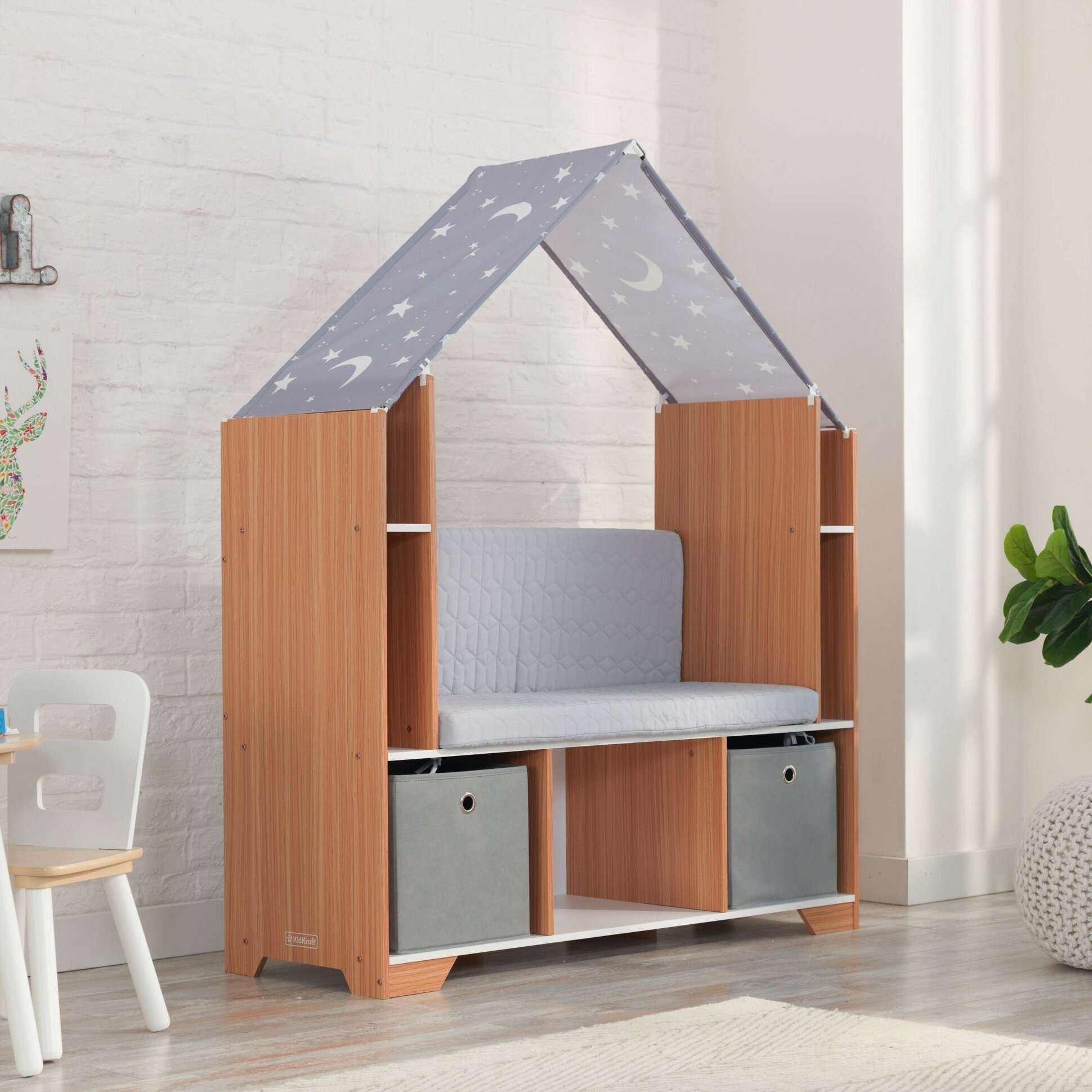 the gray bookcase with a moon and star patterned canopy