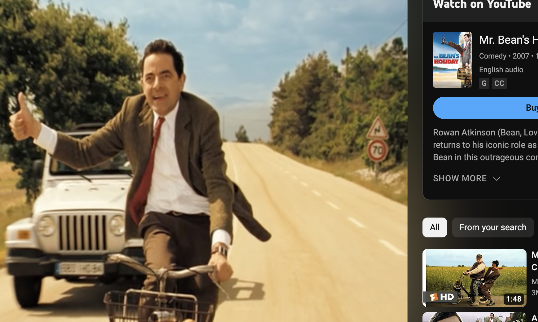 Rowan Atkinson as Mr. Bean from &quot;Mr. Bean&#x27;s Holiday&quot; is riding a bicycle down the road