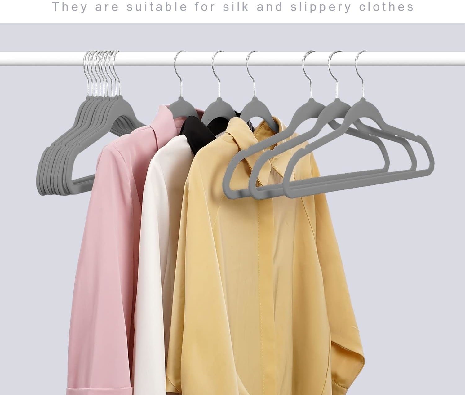 clothes hanging on gray velvet hangers