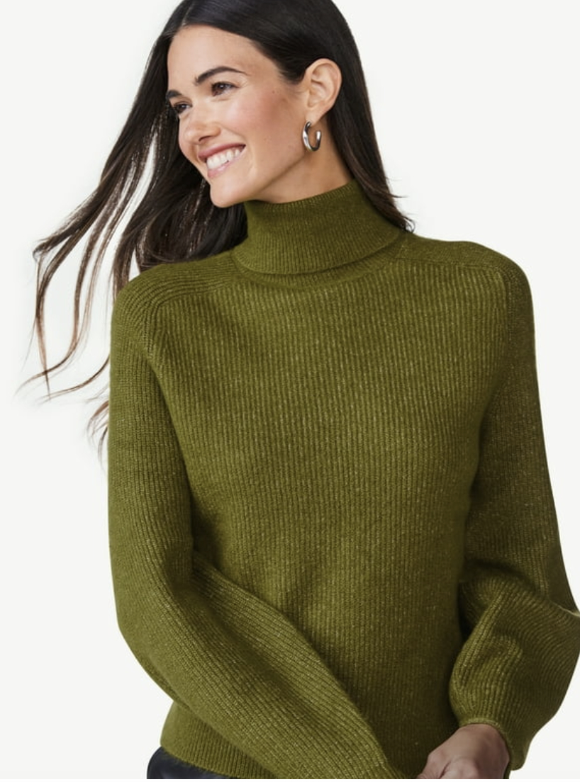 A green oversized turtleneck sweater